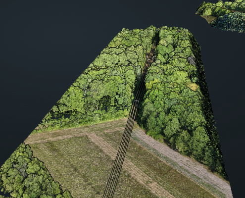 Mission drone LiDAR en Centre Val de Loire avec modélisation 3D d'un secteur boisé traversé par une voie d'accès